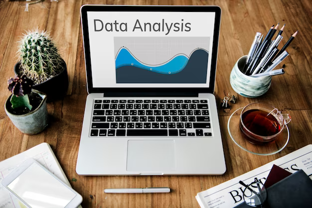 Laptop screen with data analysis and graph